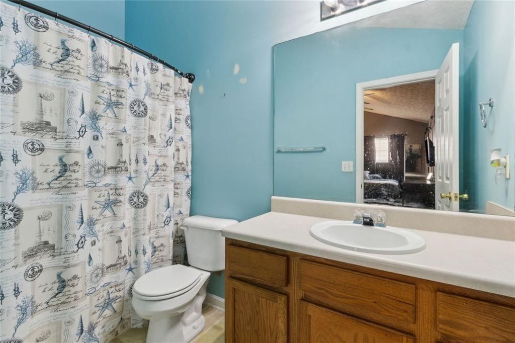 163 Silver Fox Trail Dallas, GA 30157 - Photo 17 of 35 a bathroom with a sink toilet and shower
