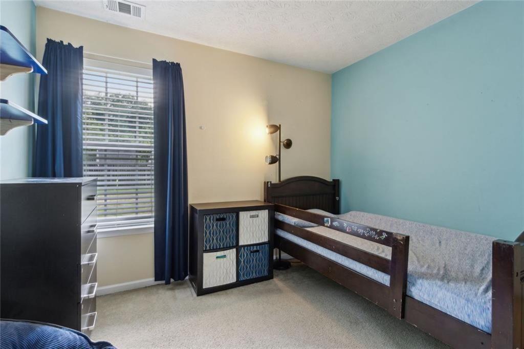 163 Silver Fox Trail Dallas, GA 30157 - Photo 19 of 35 a bedroom with furniture and a window