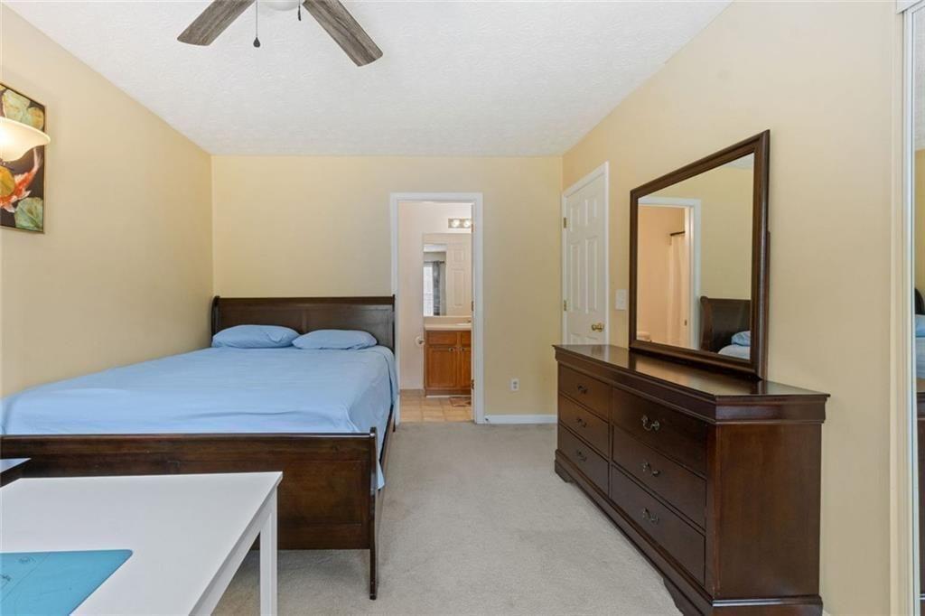 163 Silver Fox Trail Dallas, GA 30157 - Photo 24 of 35 a bedroom with a bed and window