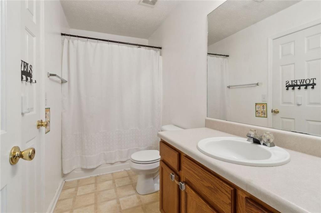 163 Silver Fox Trail Dallas, GA 30157 - Photo 25 of 35 a bathroom with a sink toilet and shower