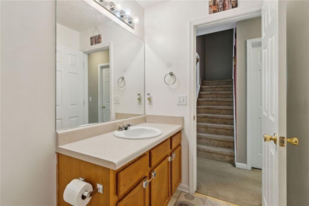 163 Silver Fox Trail Dallas, GA 30157 - Photo 26 of 35 a bathroom with a sink and a mirror