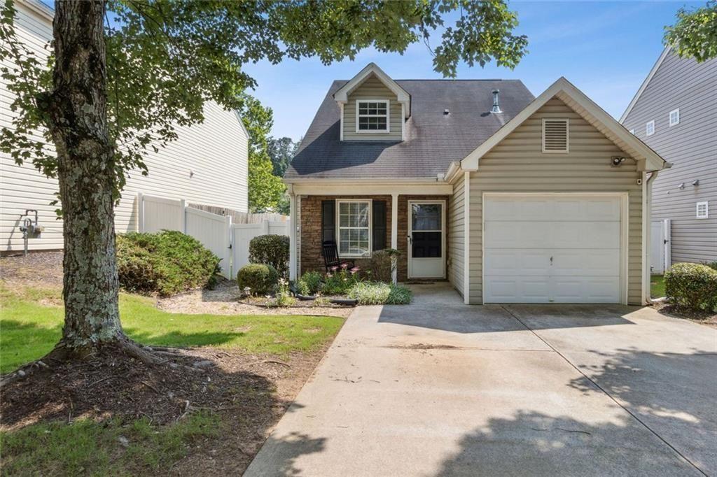 163 Silver Fox Trail Dallas, GA 30157 - Photo 31 of 35 a front view of a house with a yard and garage