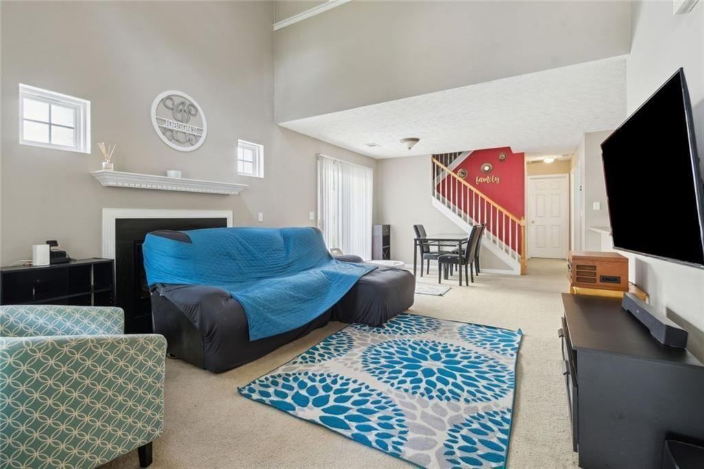 163 Silver Fox Trail Dallas, GA 30157 - Photo 35 of 35 a living room with furniture and a flat screen tv