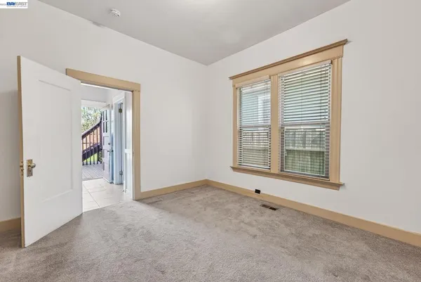 a view of an empty room with a window