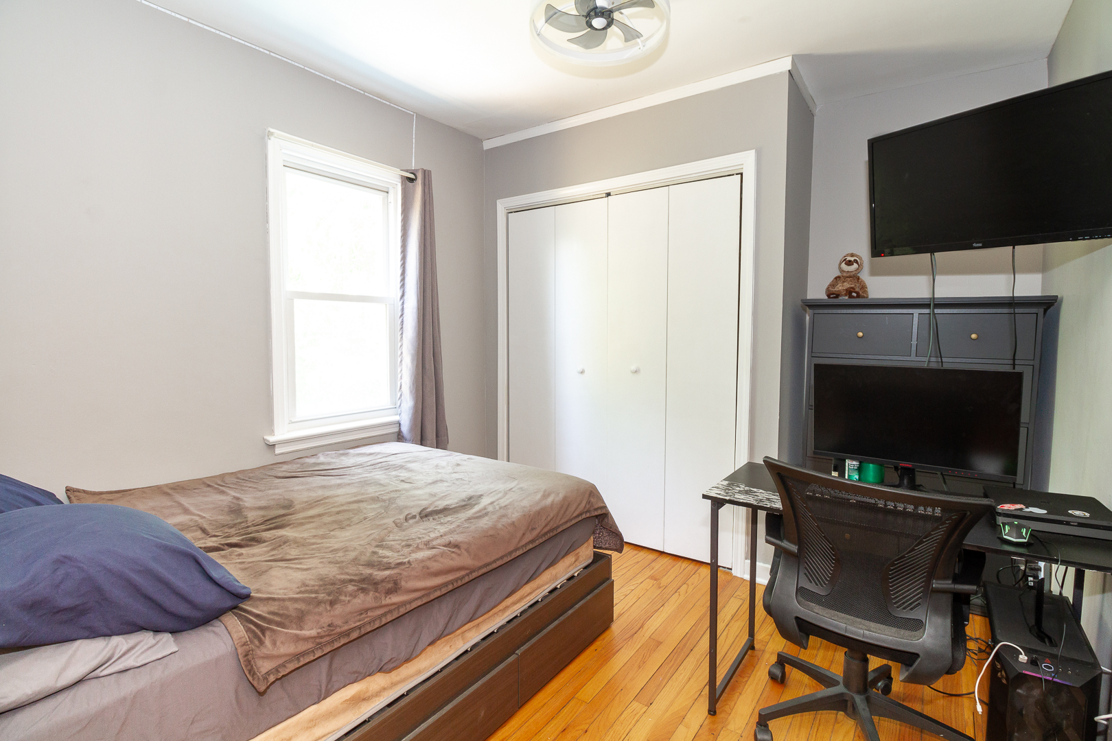 1305 Daly Road Wheaton, IL 60187 - Photo 16 of 27 a bedroom with a bed and a flat screen tv