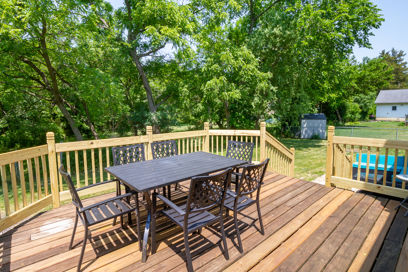 1305 Daly Road Wheaton, IL 60187 - Photo 24 of 27 a view of a roof deck with table and chairs wooden floor and fence