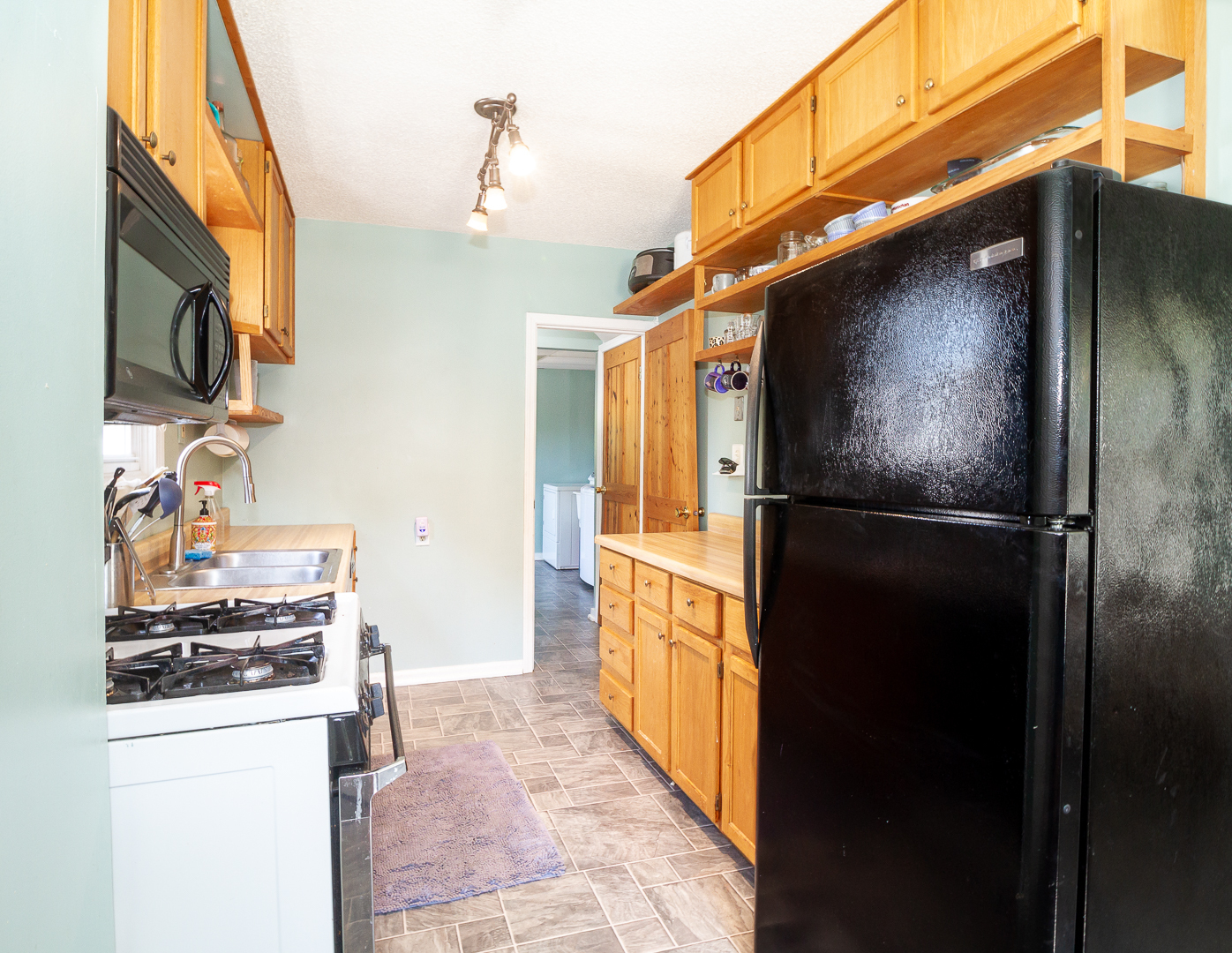 1305 Daly Road Wheaton, IL 60187 - Photo 7 of 27 a kitchen with a refrigerator and a stove
