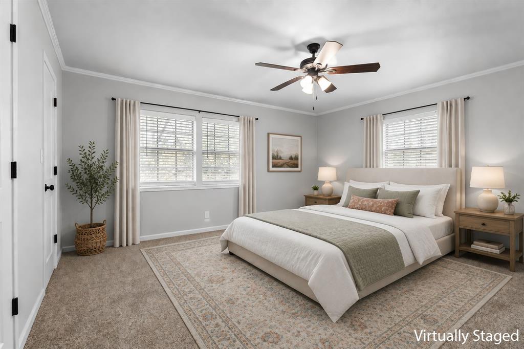373 Ingred Street Waco, TX 76705 - Photo 17 of 39 a bedroom with a large bed and a chandelier