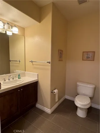 a utility room with cabinets washer and dryer