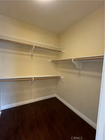 a view of an empty walk in closet