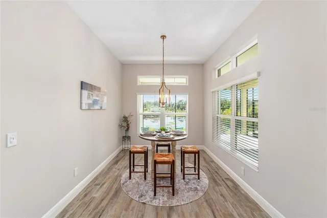 a dining room with furniture and windows