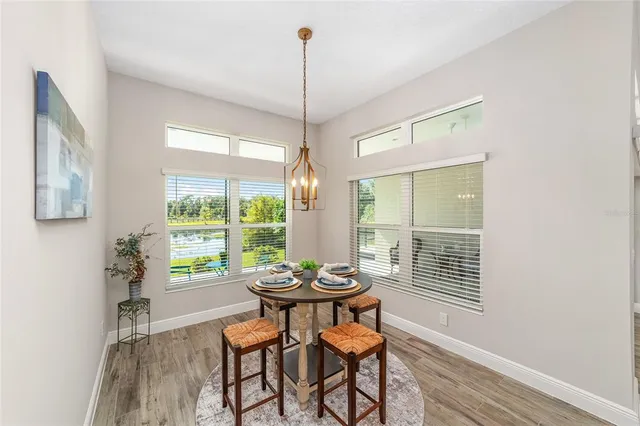 a view of a room with furniture and window