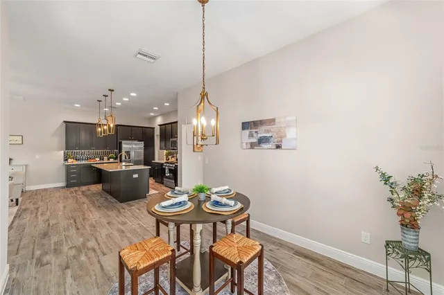 a kitchen with a table and chairs in it