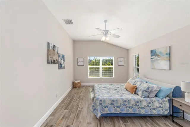 a bedroom with furniture and a window