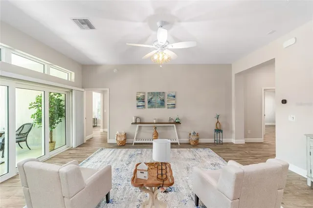 a living room with furniture and a large window