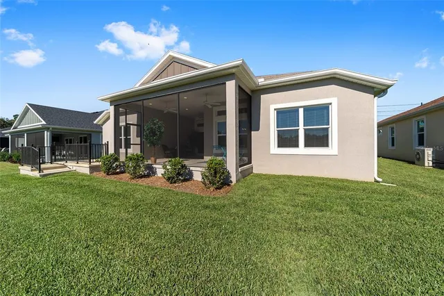 a view of a house with backyard porch and garden
