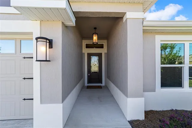 a view of a hallway with wooden shelves