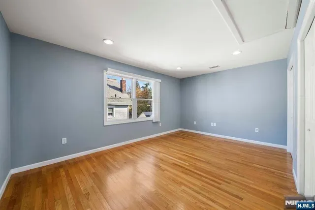 a view of an empty room with windows