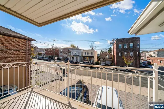 a view of a balcony with city view