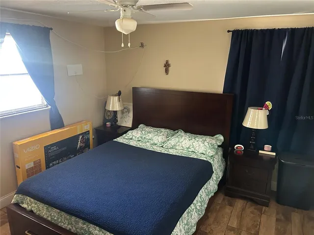 a bedroom with a bed and cabinets