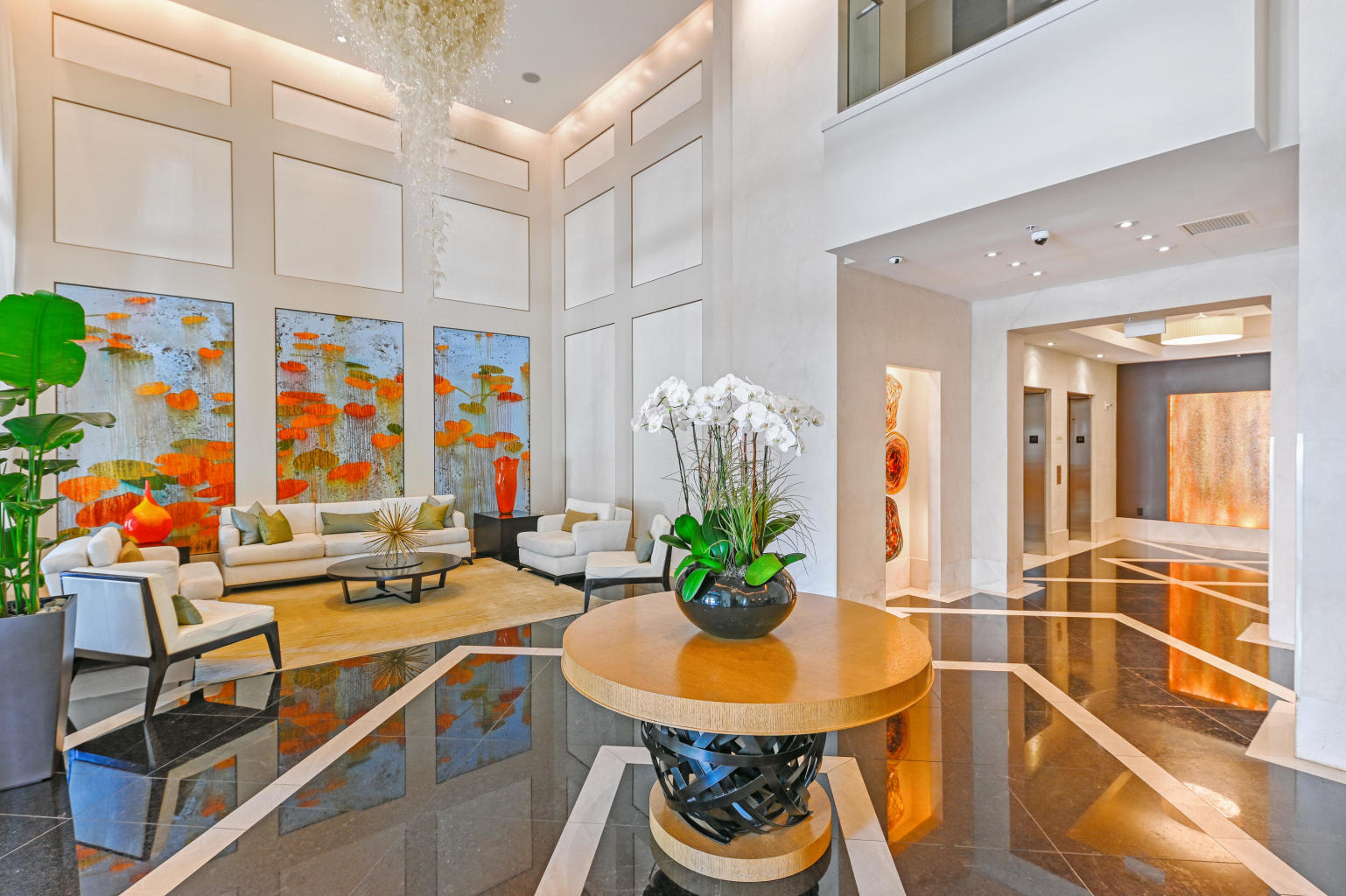 550 Okeechobee Boulevard, Unit 1721 West Palm Beach, FL 33401 - Photo 12 of 12 a view of a dining room with furniture one side kitchen view and wooden floor