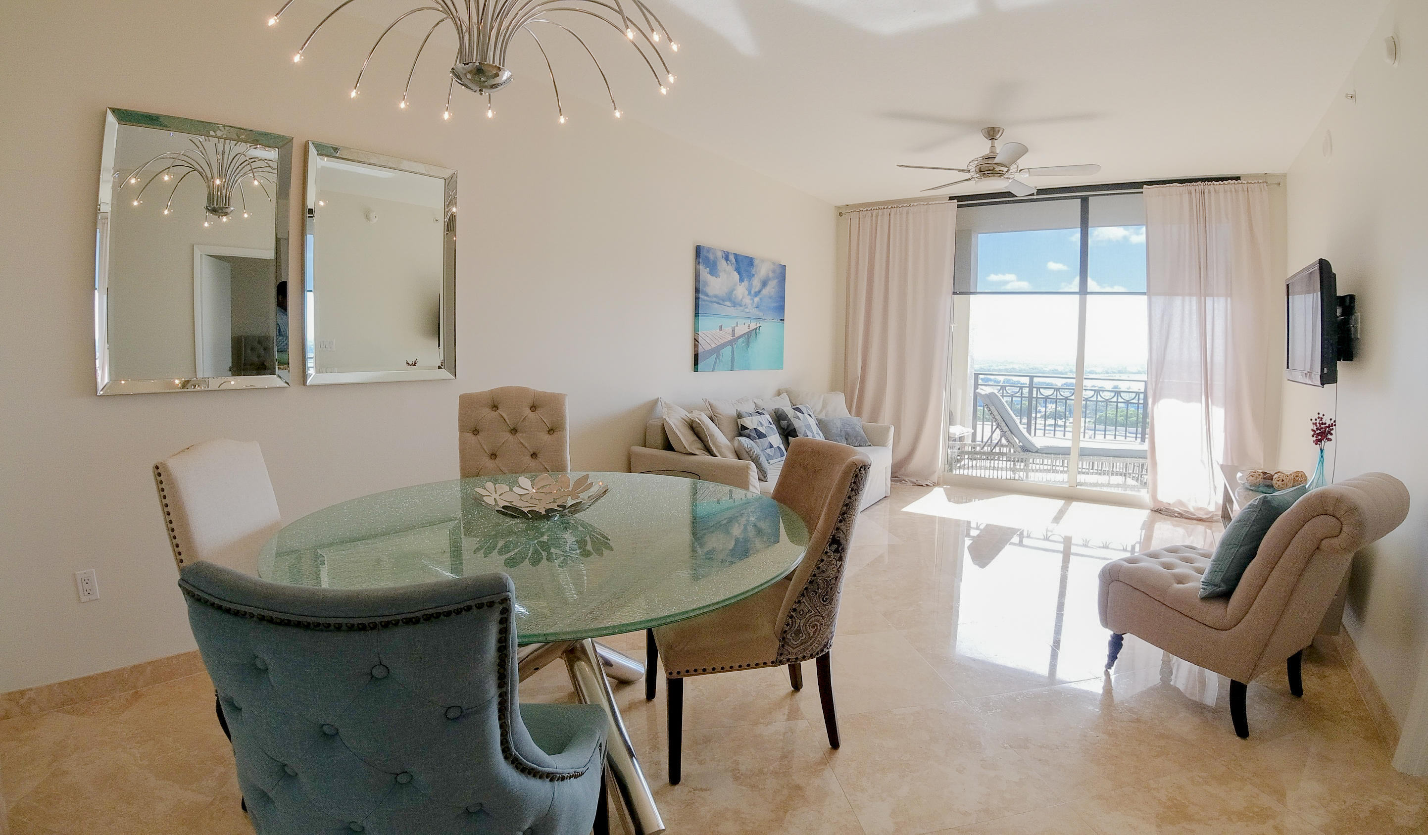 550 Okeechobee Boulevard, Unit 1721 West Palm Beach, FL 33401 - Photo 2 of 12 a view of a dining room with furniture and windows