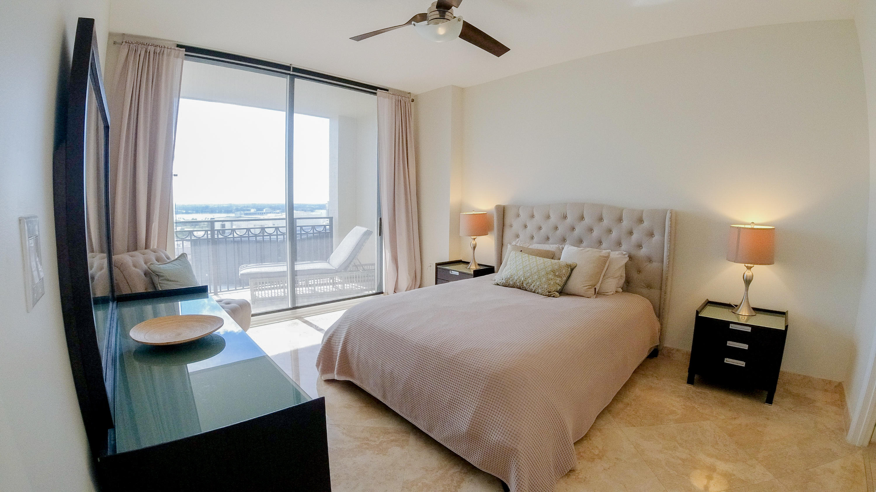 550 Okeechobee Boulevard, Unit 1721 West Palm Beach, FL 33401 - Photo 3 of 12 a bedroom with a bed and a large window