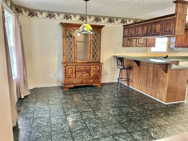 a bathroom with a sink vanity and a mirror
