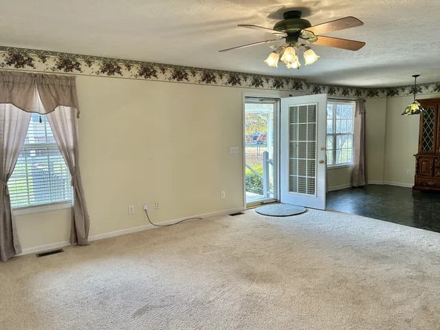a kitchen with a stove window and cabinets