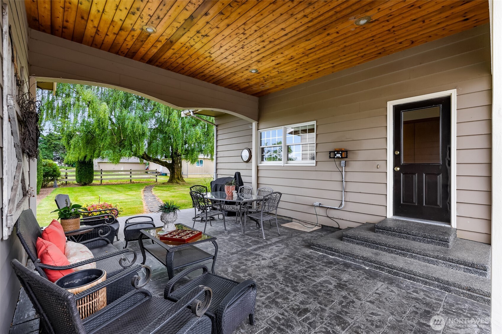 8634 Double Ditch Road Lynden, WA 98264 - Photo 19 of 40 a backyard of a house with outdoor seating