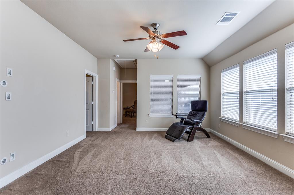 817 Deer Ridge Trail McKinney, TX 75072 - Photo 20 of 35 2nd floor game room with wall of windows and ceiling fan