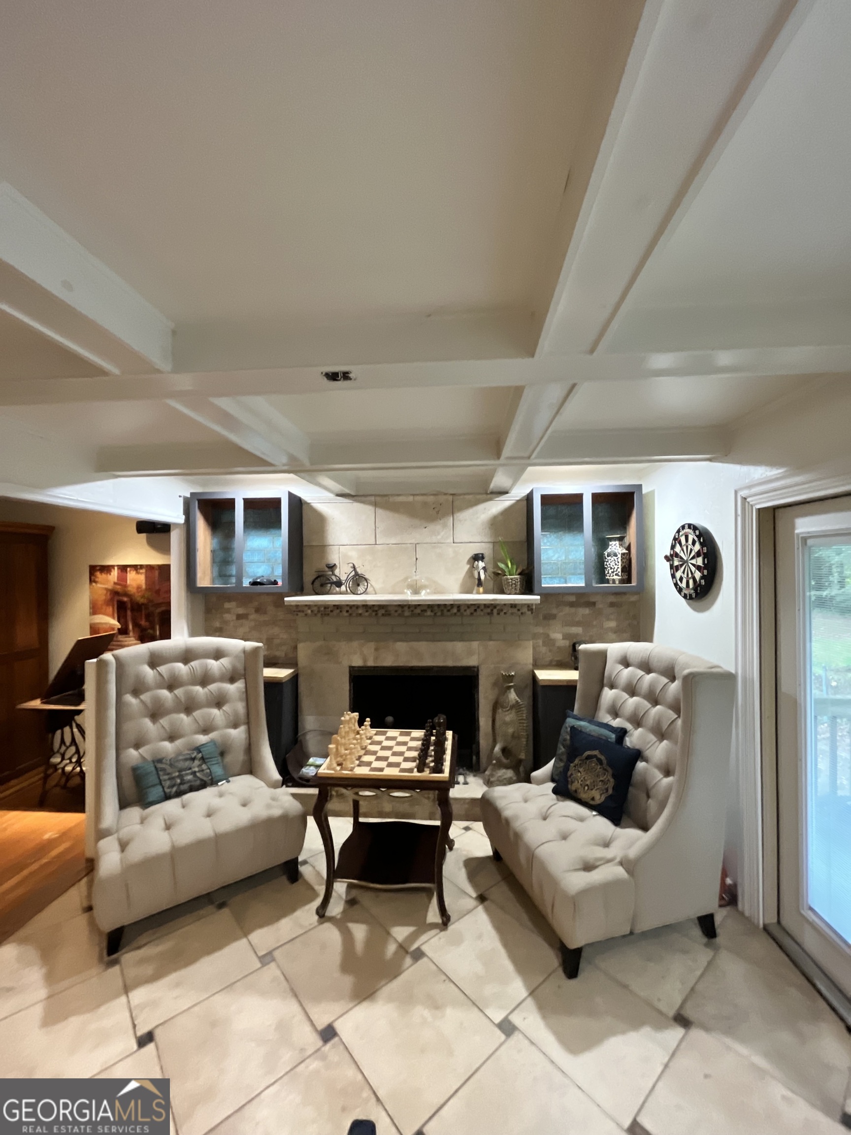 6450 East Stubbs Road South Fulton, GA 30349 - Photo 17 of 33 a living room with furniture and a fireplace