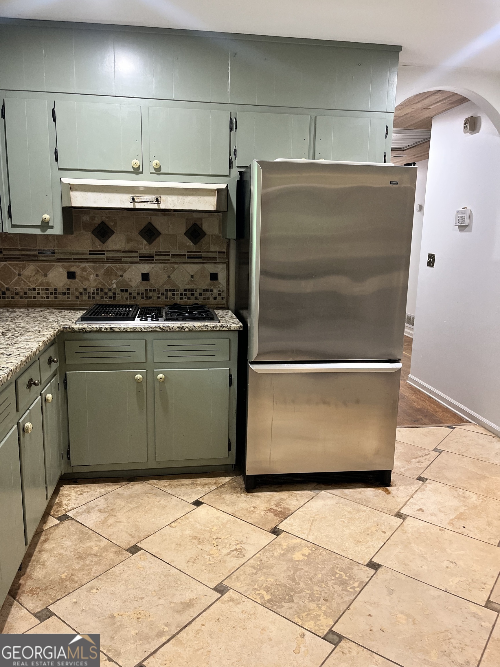 6450 East Stubbs Road South Fulton, GA 30349 - Photo 20 of 33 a kitchen with a stove and a refrigerator