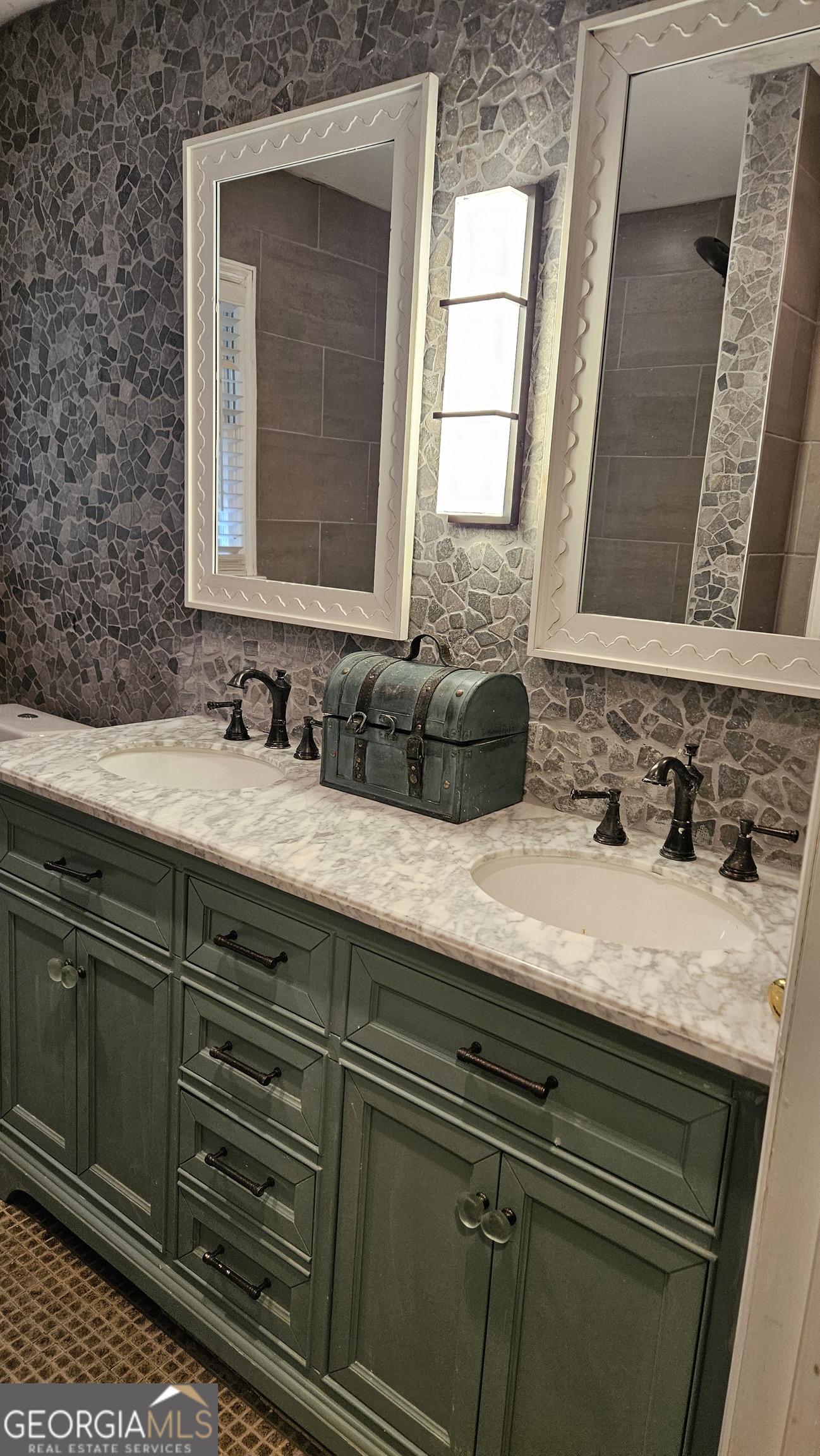 6450 East Stubbs Road South Fulton, GA 30349 - Photo 21 of 33 a bathroom with a sink and a mirror