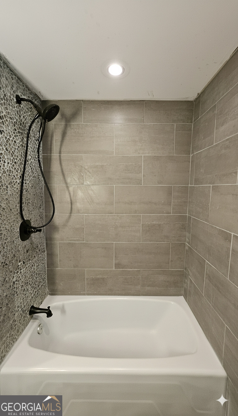 6450 East Stubbs Road South Fulton, GA 30349 - Photo 22 of 33 a bathroom with a shower and a bathtub