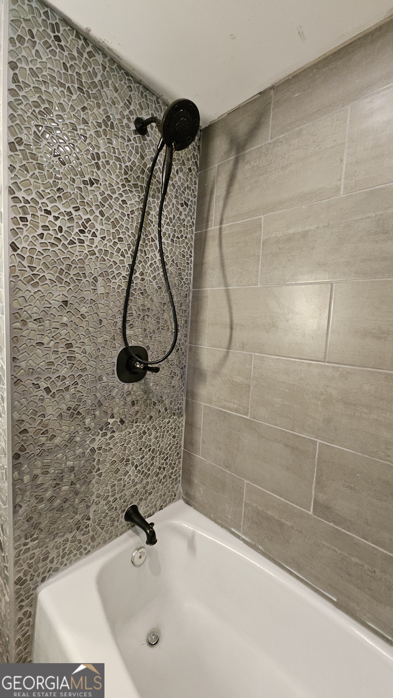 6450 East Stubbs Road South Fulton, GA 30349 - Photo 23 of 33 a bathroom with a sink a mirror and shower