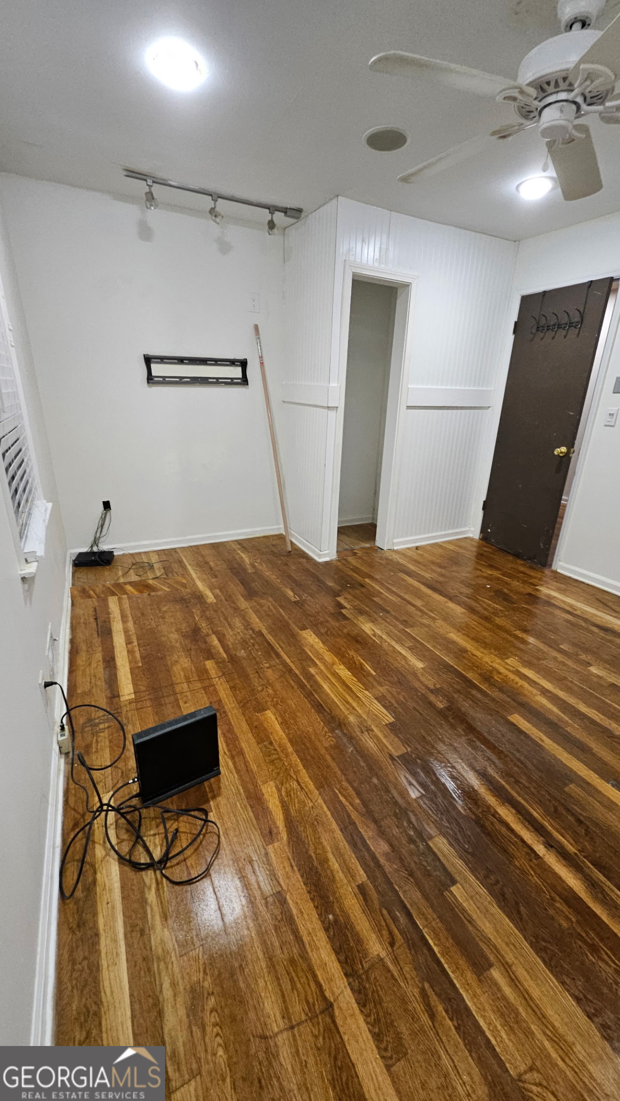 6450 East Stubbs Road South Fulton, GA 30349 - Photo 24 of 33 a bedroom with a bed and a mirror