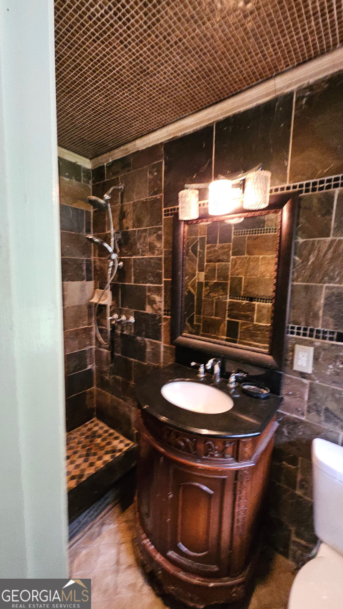 6450 East Stubbs Road South Fulton, GA 30349 - Photo 28 of 33 a room with water heater and wooden floor