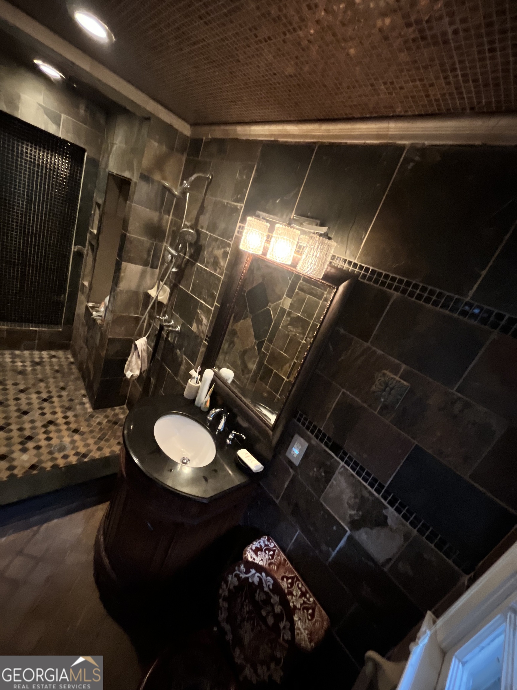 6450 East Stubbs Road South Fulton, GA 30349 - Photo 29 of 33 a bathroom with a sink and a mirror