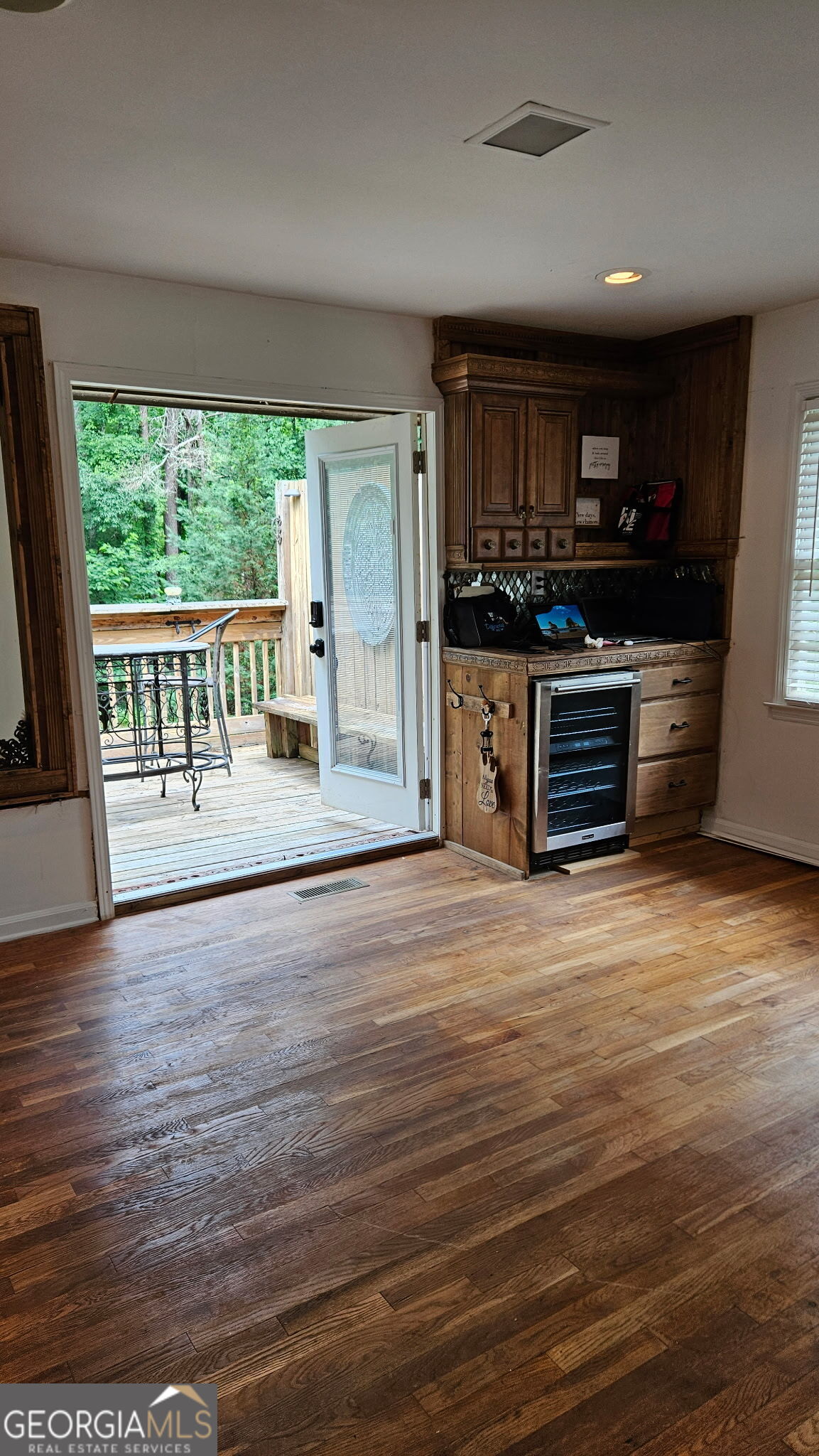 6450 East Stubbs Road South Fulton, GA 30349 - Photo 30 of 33 an empty room with wooden floor and windows