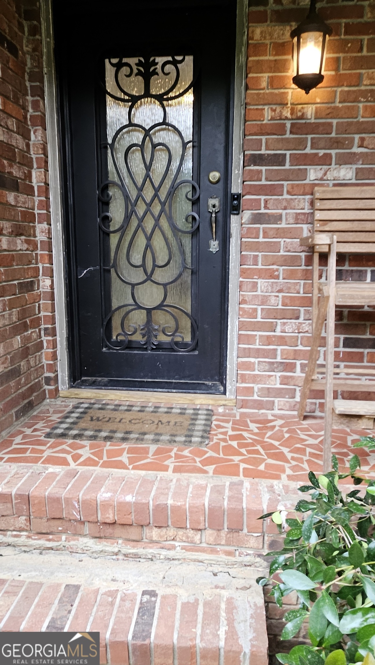 6450 East Stubbs Road South Fulton, GA 30349 - Photo 6 of 33 a view of a door with a bench