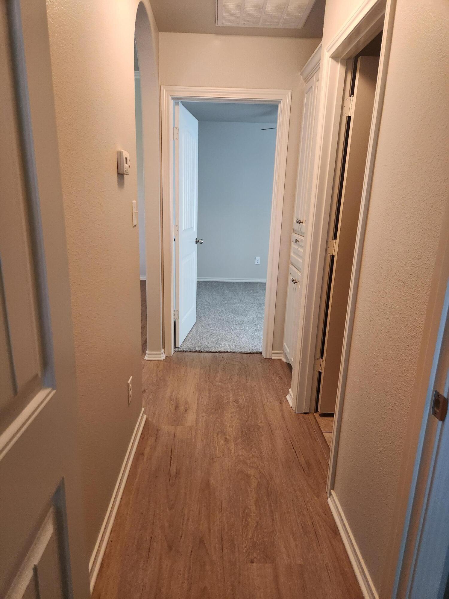 8702 13th Street Lubbock, TX 79416 - Photo 20 of 25 wooden floor in a gallery