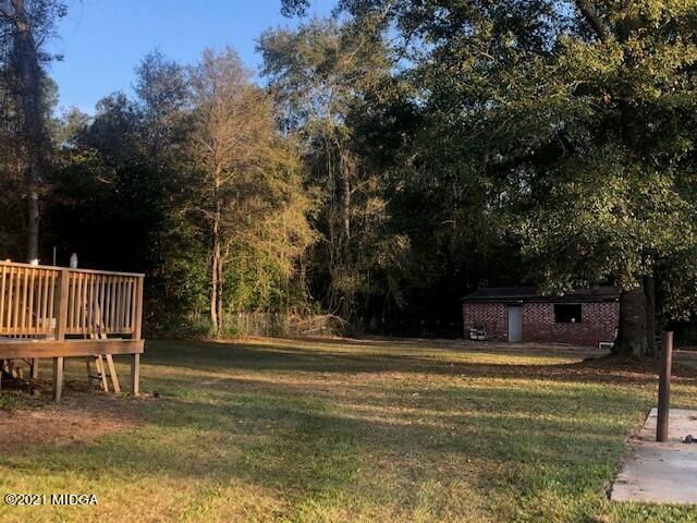 5310 Dixon Road Lizella, GA 31052 - Photo 13 of 18 a swimming pool with outdoor seating and yard