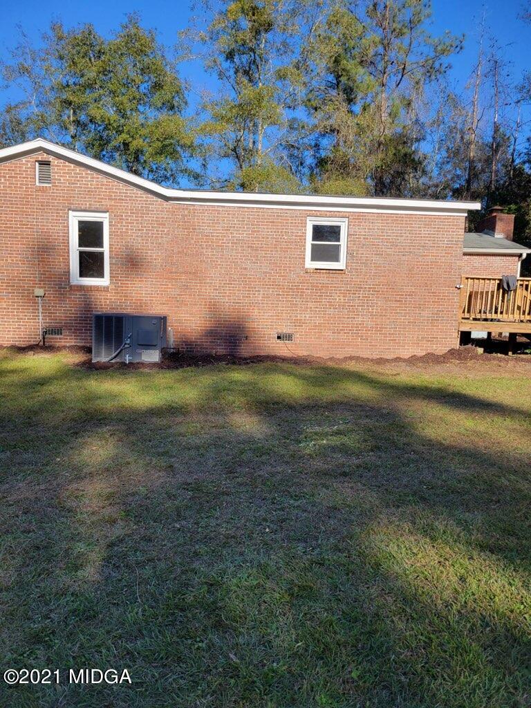 5310 Dixon Road Lizella, GA 31052 - Photo 15 of 18 a view of a house with a yard
