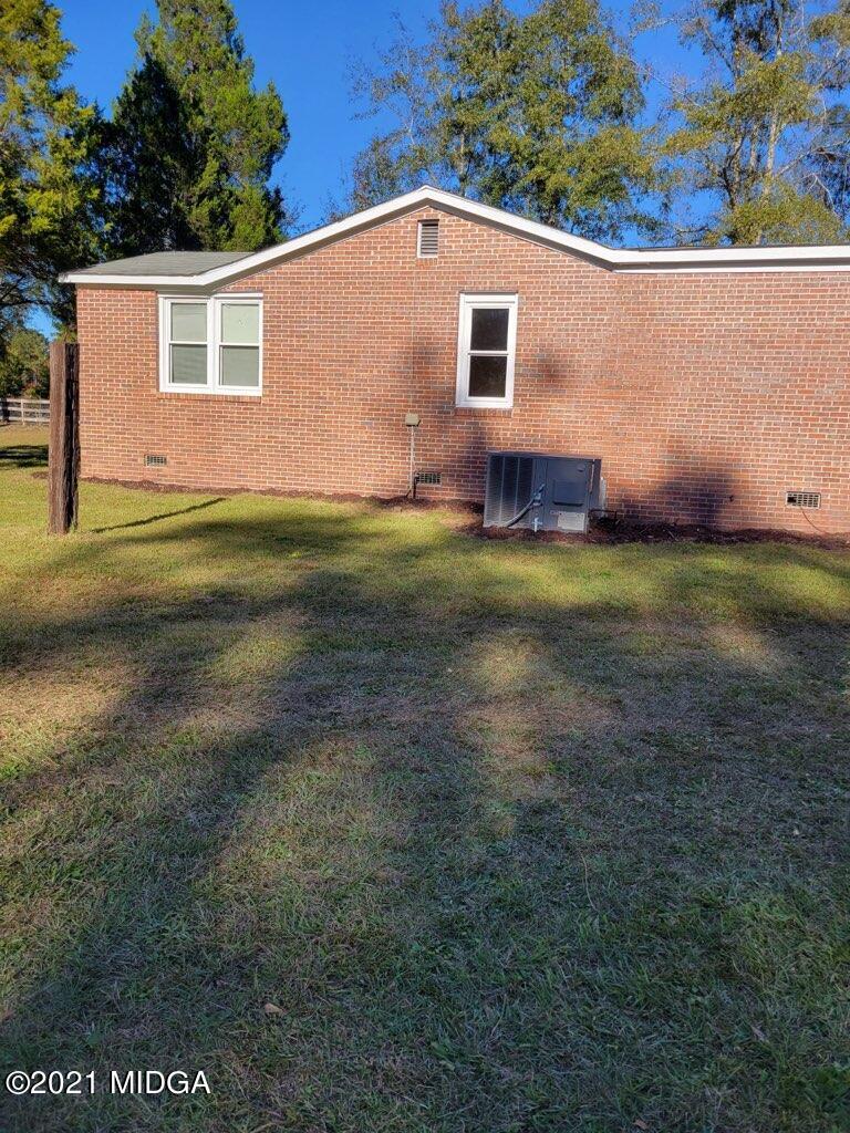 5310 Dixon Road Lizella, GA 31052 - Photo 16 of 18 a view of house with backyard