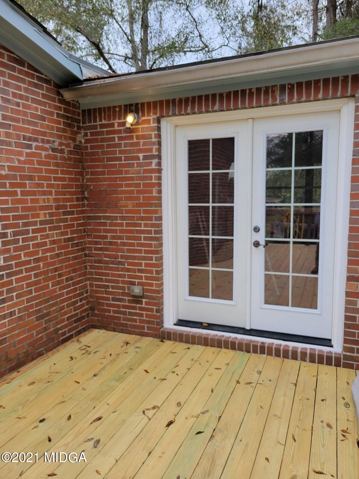 5310 Dixon Road Lizella, GA 31052 - Photo 17 of 18 a view of a brick house with a backyard