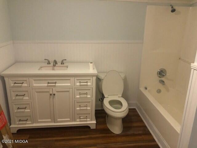 5310 Dixon Road Lizella, GA 31052 - Photo 6 of 18 a bathroom with a granite countertop toilet sink and mirror