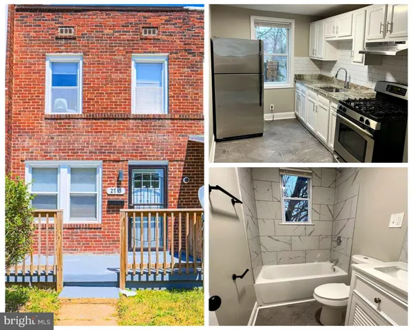 a view of kitchen with stainless steel appliances granite countertop a stove top oven a sink and a dining table