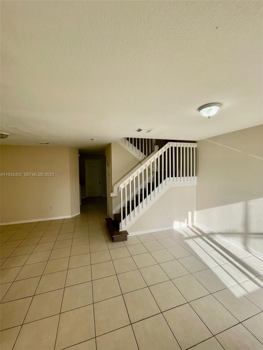 24343 Southwest 109th Avenue Homestead, FL 33032 - Photo 5 of 26 a view of an entryway with a floor