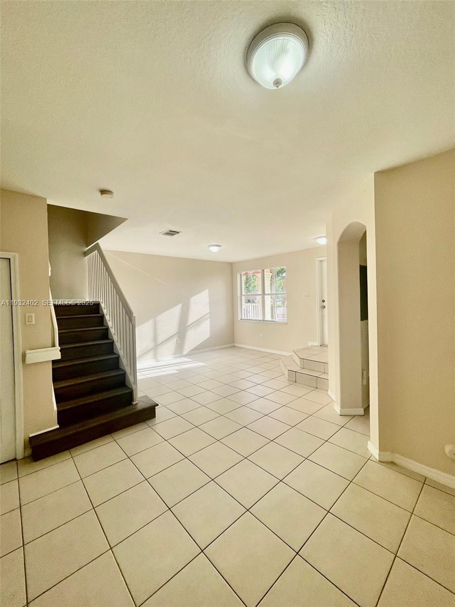 24343 Southwest 109th Avenue Homestead, FL 33032 - Photo 7 of 26 a view of a livingroom with wooden floor and window
